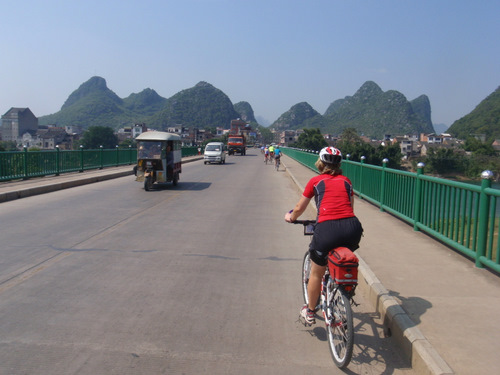 Mary and others crossing a bridge.